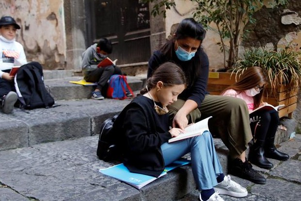 Naples teachers bring socially distanced school to streets and balconies