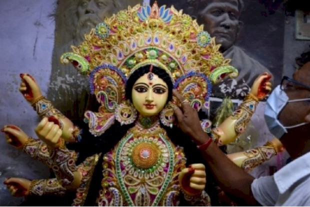 Low-key Durga idol immersion in Ichamati river under COVID shadow Low-key Durga idol immersion in Ichamati river under COVID shadow
