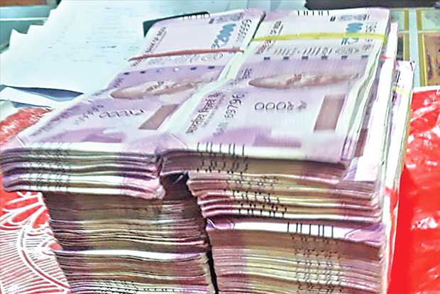 Cash seizure triggers war of words between BJP, TRS