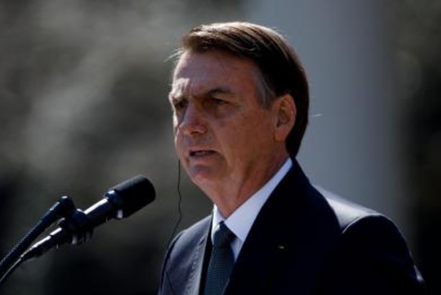 Bolsonaro plays down Amazon fires, accuses NGOs of blocking land titling