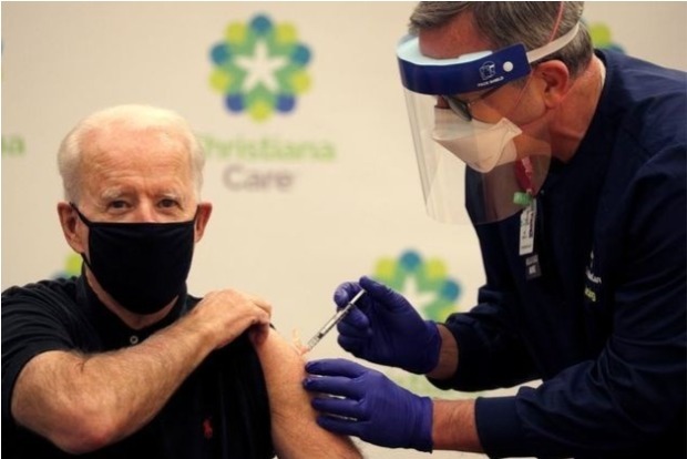 Hitting latest vaccine milestone, Biden pushes shots for all