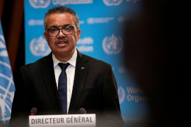 WHO, Macron condemn global vaccine divide as COVAX scheme marks first year