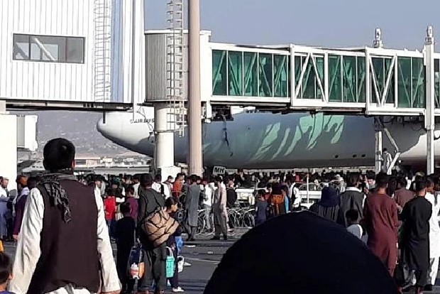 Afghans clinging to side of US military aircraft as it prepares to take off