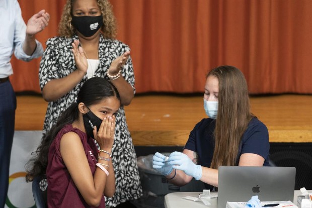 FDA expands Pfizer Covid booster, opens extra dose to age 16