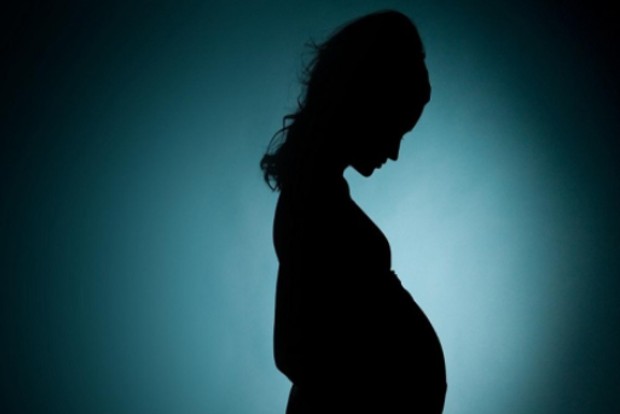 Activist dressed like pregnant woman submits petition for maternity aid