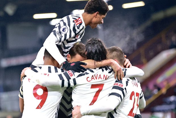 Manchester United beats Burnley to go top of Premier League