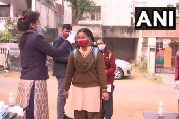 Smiles, sanitizers welcome students as schools reopen in Delhi