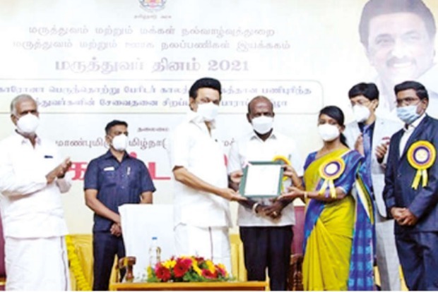 CM honours Nilgiris Collector for cent per cent vaccination of tribals