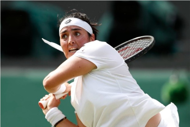 Jabeur casts spell over Muguruza to reach last 16