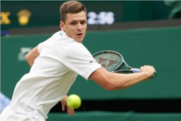 Hurkacz faces idol Federer in 1st Grand Slam quarterfinal