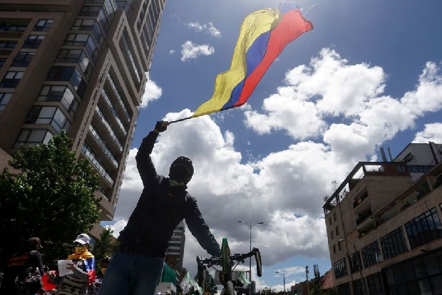 In Colombia, protesters march on as talks stall and blockades remain