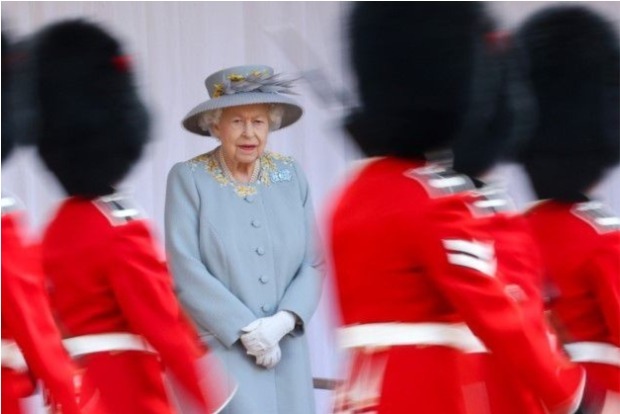 Trooping the Colour: Queen Elizabeth beams watching parading soldiers in her honour