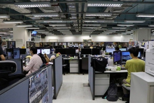 Two Apple Daily executives charged with collusion with foreign country