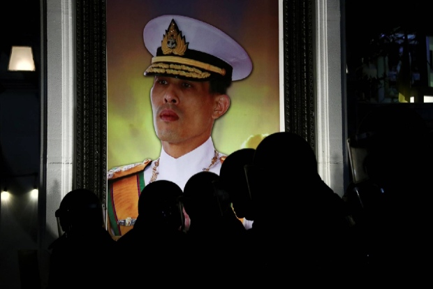 Thai activist accused of burning kings portrait arrested