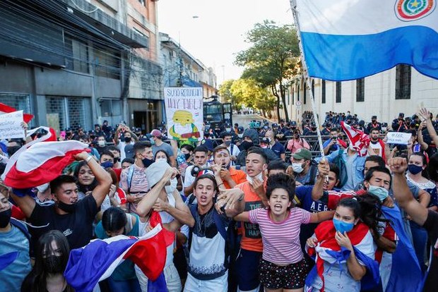 Fire, smoke, gunshots in Paraguay capital as pandemic response ignites protests