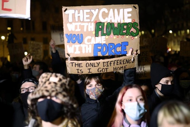 Hundreds protest outside UK Parliament and police headquarters for third night