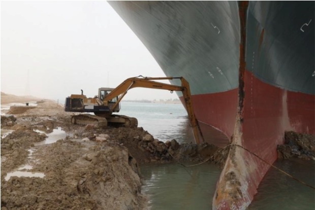 Stuck ship thrusts sleepy Suez Canal village into limelight