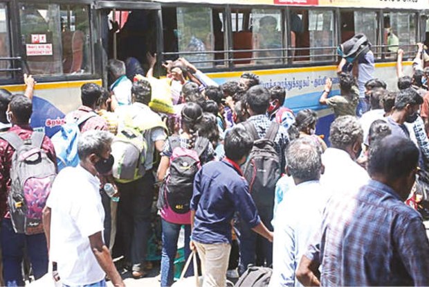 LOCKDOWN 2.0: Migrant workers throng bus stands flouting COVID norms