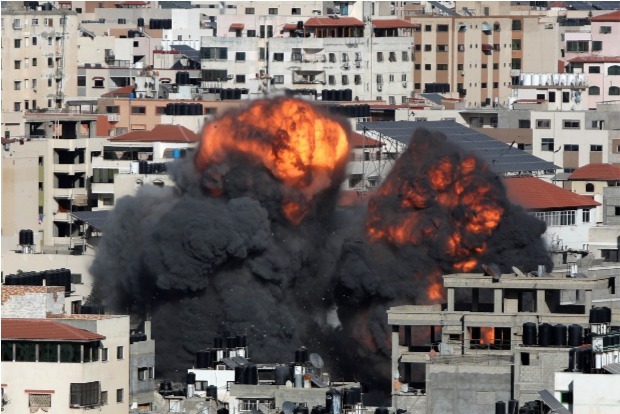 Medics: Israeli airstrikes kill 23 in downtown Gaza City
