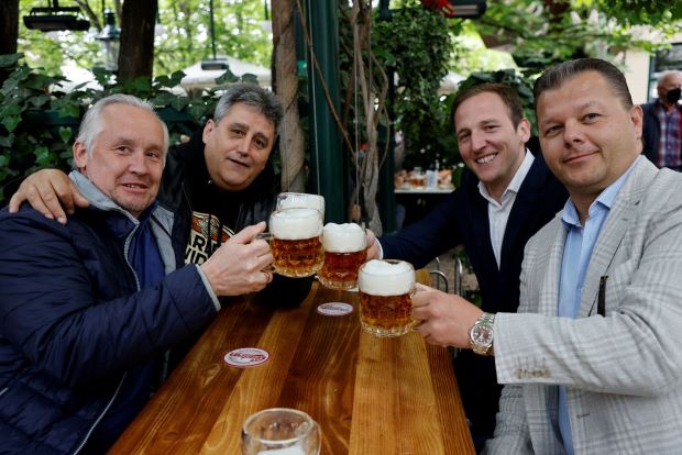 Europeans savour croissants and beers as cafes reopen
