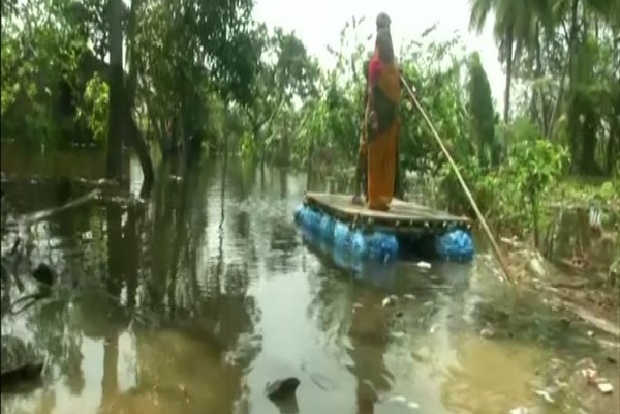 Cyclone Yaas: Villagers use rafts to commute in submerged villages of WBs East Midnapore