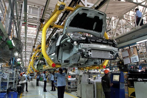 Carmakers in Indias Detroit allowed to operate as workers protest COVID risk