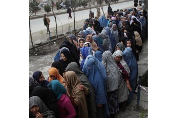 Under Taliban regime poor Afghan women beg at bakeries to feed children