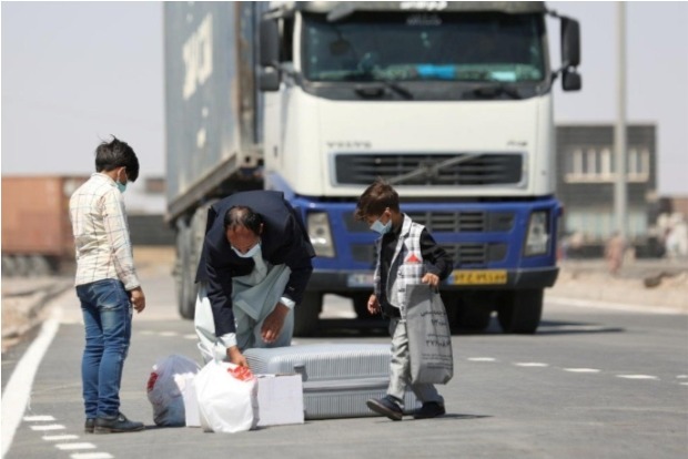 With no evacuation flights, Afghans weigh risky overland trips to borders