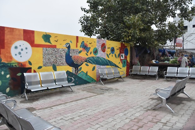 Garbage point aesthetically transformed with wall-painting, chairs in Jammu