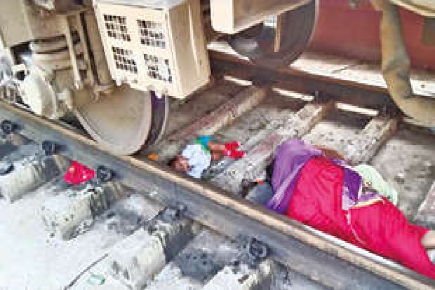 Mother, child escape miraculously after falling under moving train