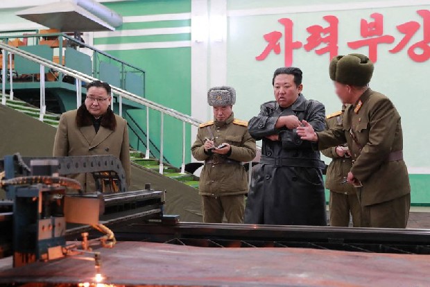 North Korea confirms latest weapons tests as Kim visits key munitions factory
