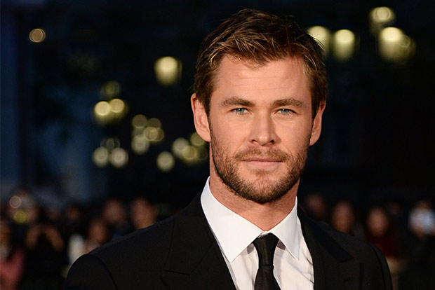 Why does Chris Hemsworth love surfing?