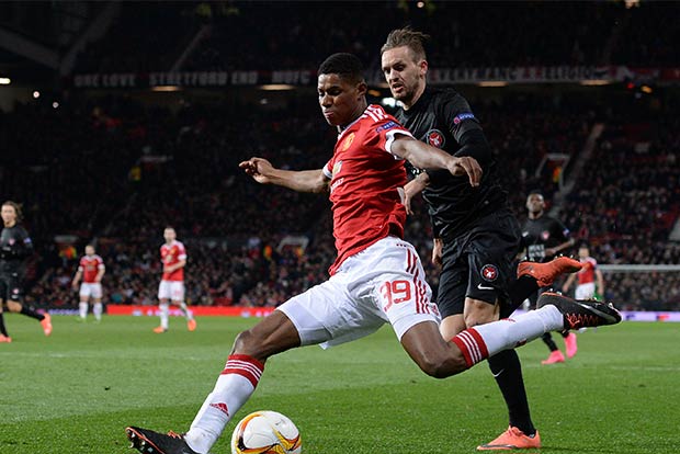 Double debut delight as Rashford rescues United