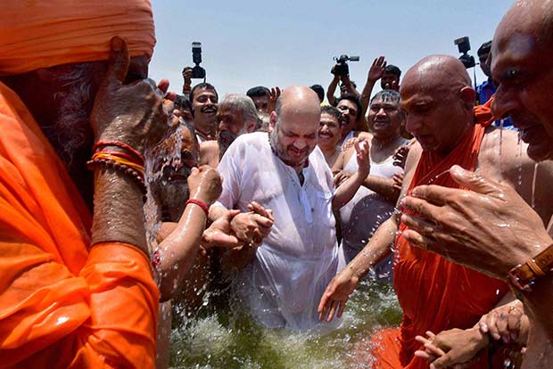 Amit Shah takes holy dip with Dalit sadhus at Kumbh