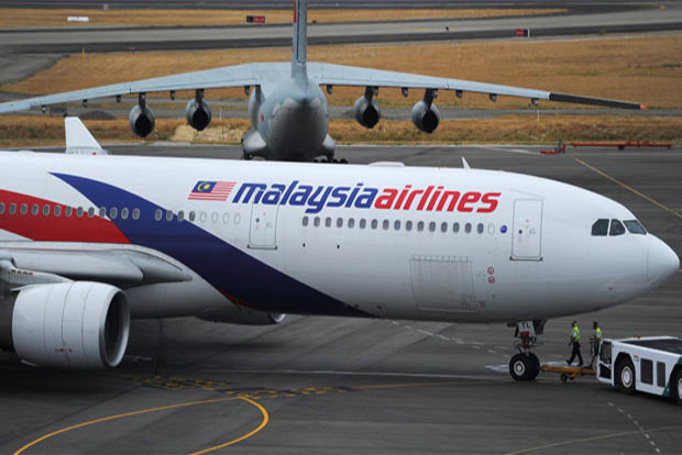 Rough seas, high winds delay search for Flight MH370