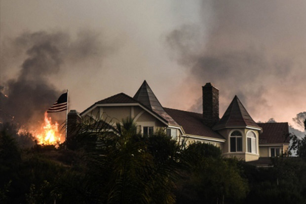 Residents flee as wildfire threatens homes near LA