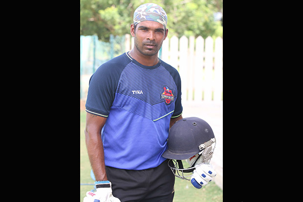 Tsunami survivor bats his way to top league