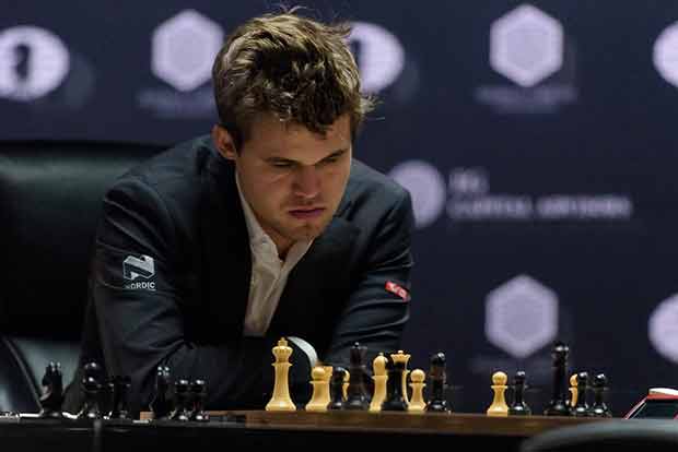 Carlsen completes double in style