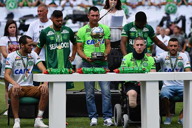 Chapecoense survivors lift trophy