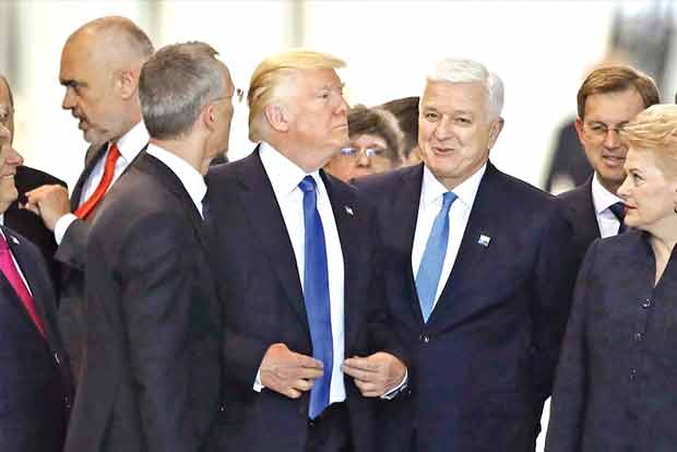 Trump shoves NATO member in viral clip Trump shoves NATO member in viral clip