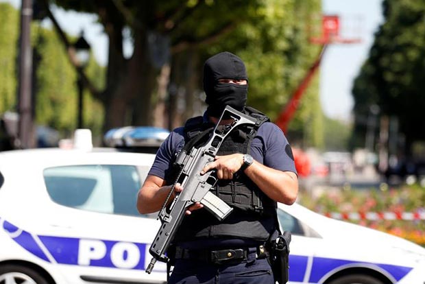 Car hits police vehicle on Paris Champs Elysees, driver arrested