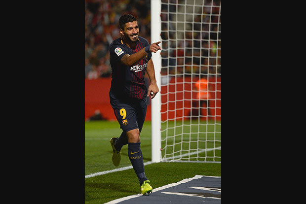 Suarez celebrates century game in style