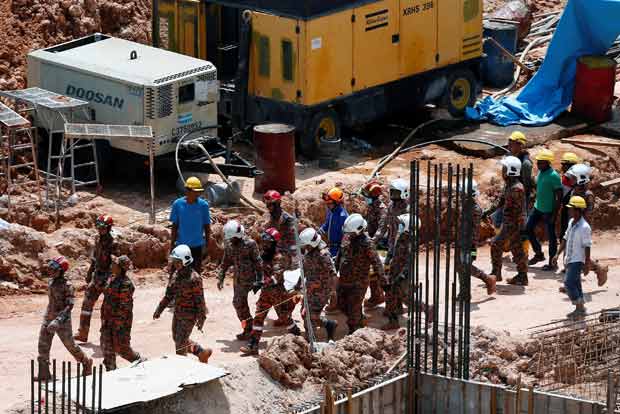 Death toll from Malaysia construction site landslide at 11